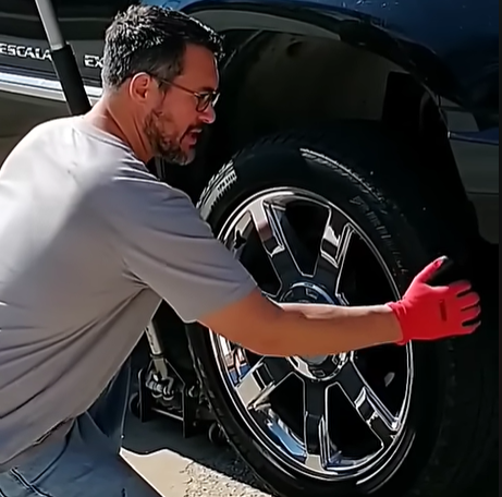 Spinning a car wheel by hand