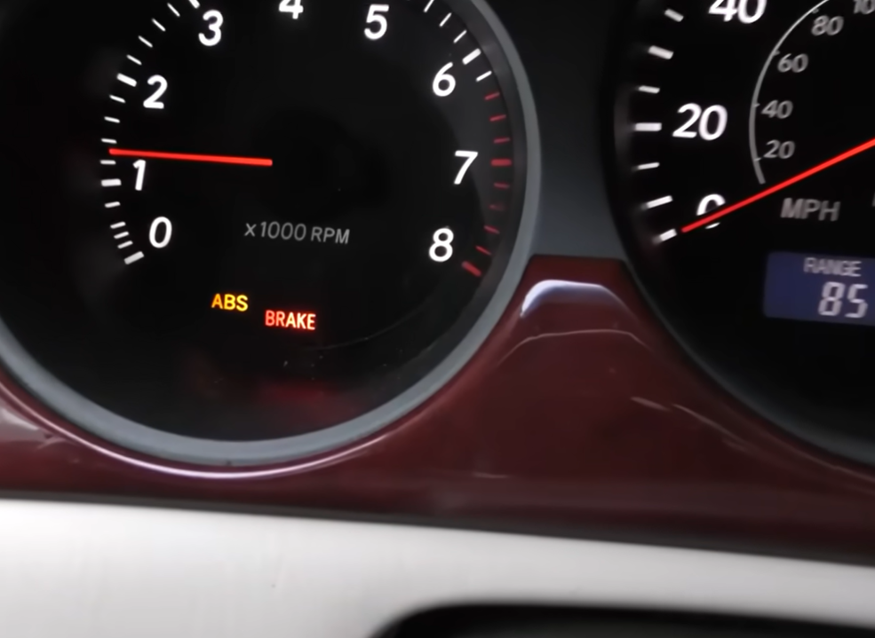ABS warning light illuminated on car dashboard