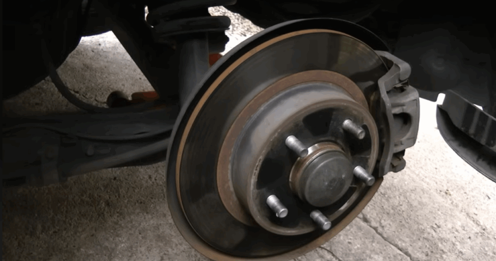 wheel hub location between axle shaft brake rotor and steering knuckle