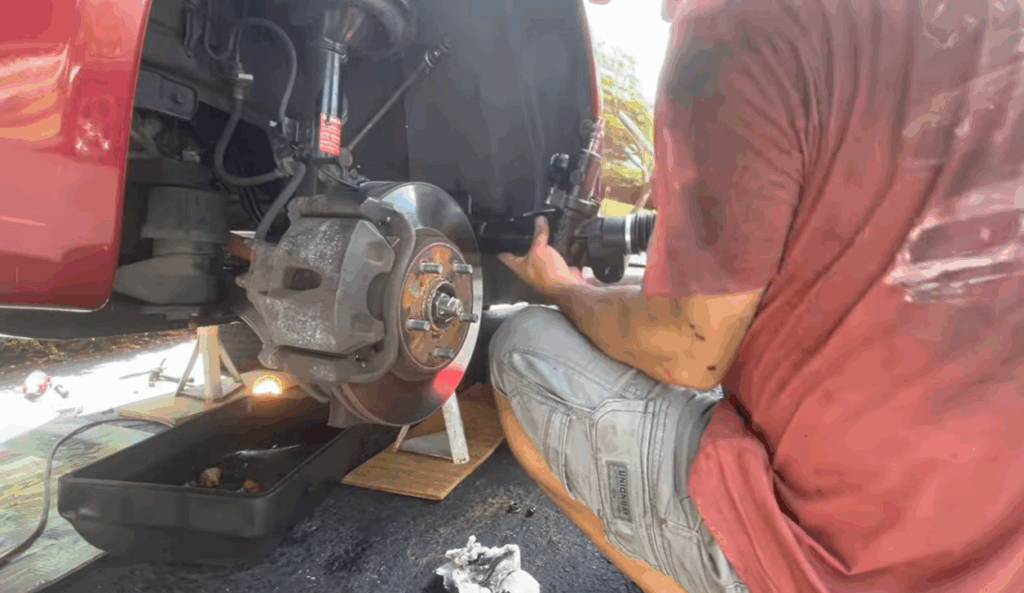 Photo showing mechanic installing a new rack and pinion 