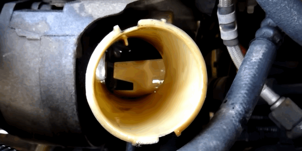 Image showing the process of removing old fluid from resevoir