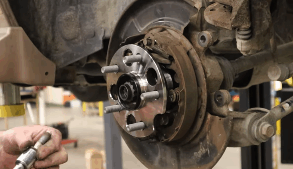 wheel bearing being installed on a car