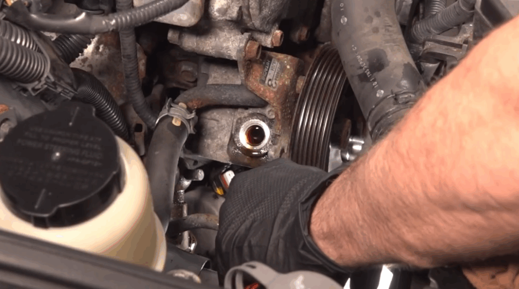 Image showing a mechanic changing old or contaminated fluid